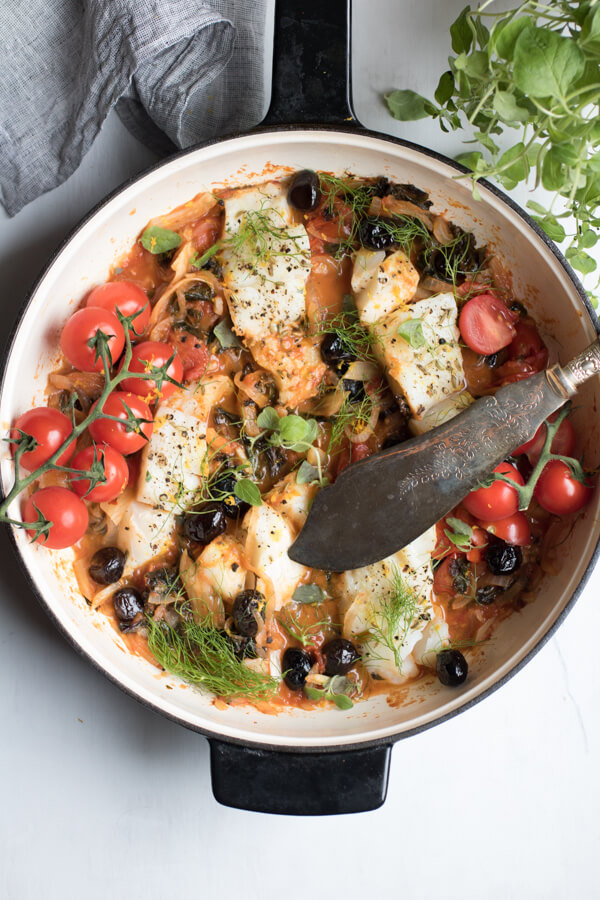 Easy One Pan Mediterranean Cod. A super healthy dinner, cooked all in one pan and ready in 30 minutes! Paleo, Gluten Free, Pescatarian, and Whole 30