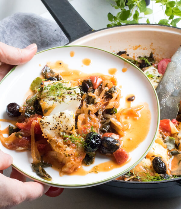 Easy One Pan Mediterranean Cod. A super healthy dinner, cooked all in one pan and ready in 30 minutes! Paleo, Gluten Free, Pescatarian, and Whole 30