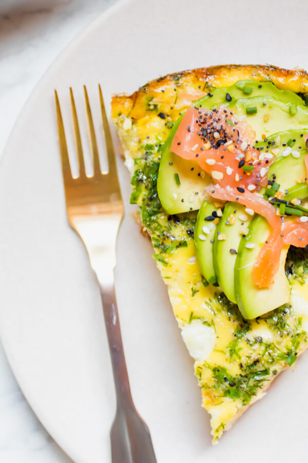 This healthy smoked salmon herb frittata recipe is perfect for brunch or a healthy delicious breakfast all week long. Filled with veggies, fresh herbs, smoked salmon, and goat cheese and topped with avocado and everything but the bagel spice. Naturally gluten free, Keto, Whole 30, and Paleo-friendly recipe.