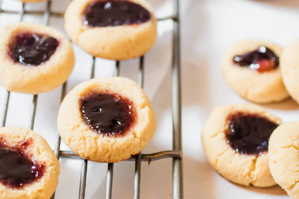 Perfectly moist and delicious gluten-free, grain-free thumbprint cookies with immune supportive elderberry Jam.