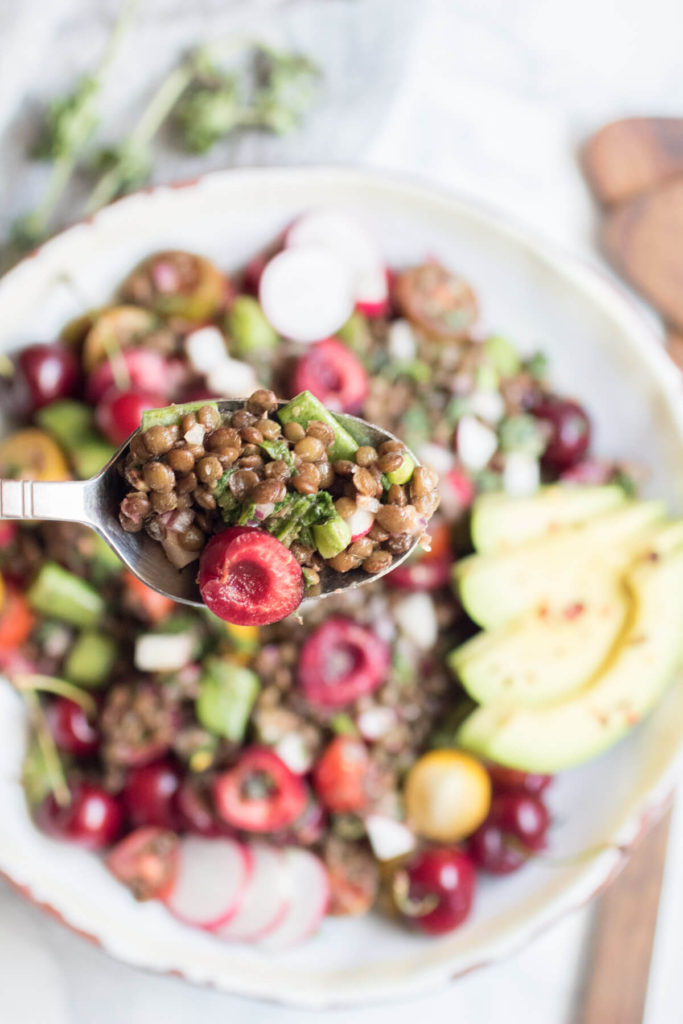 Farmer's market lentil salad with fresh cherries, sugar snap peas, and fresh oregano. A beautiful bounty of healthy local seasonal veggies and protein rich lentils. An easy to make vegan and gluten free summer salad.
