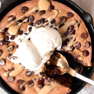 Gooey rich and decadent tahini chocolate chip cookie made in a skillet. A giant cookie that is sure to bring a smile to your face! Real food, gluten-free, no flour, or refined sugar.