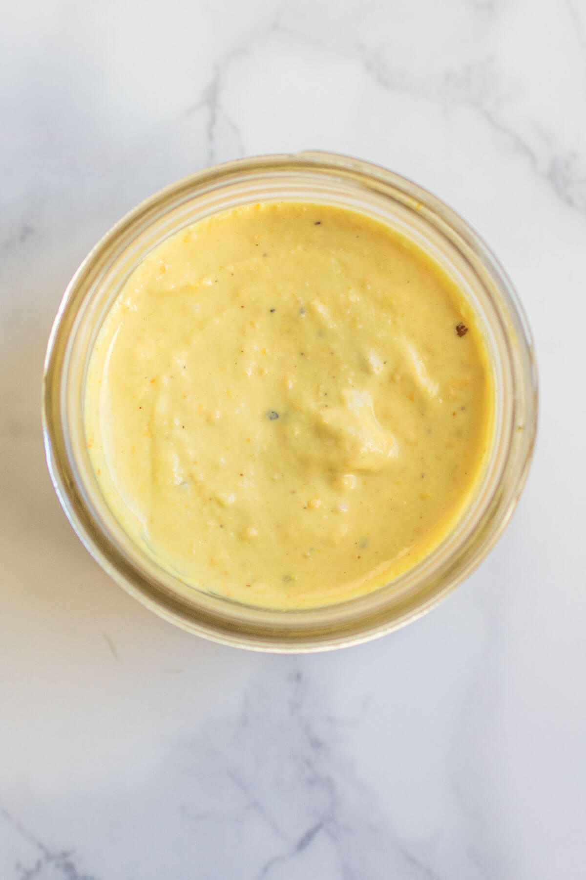 Fresh turmeric tahini dressing, only 3 ingredients. Citrusy rich and creamy, this dressing makes every salad better! |abraskitchen.com