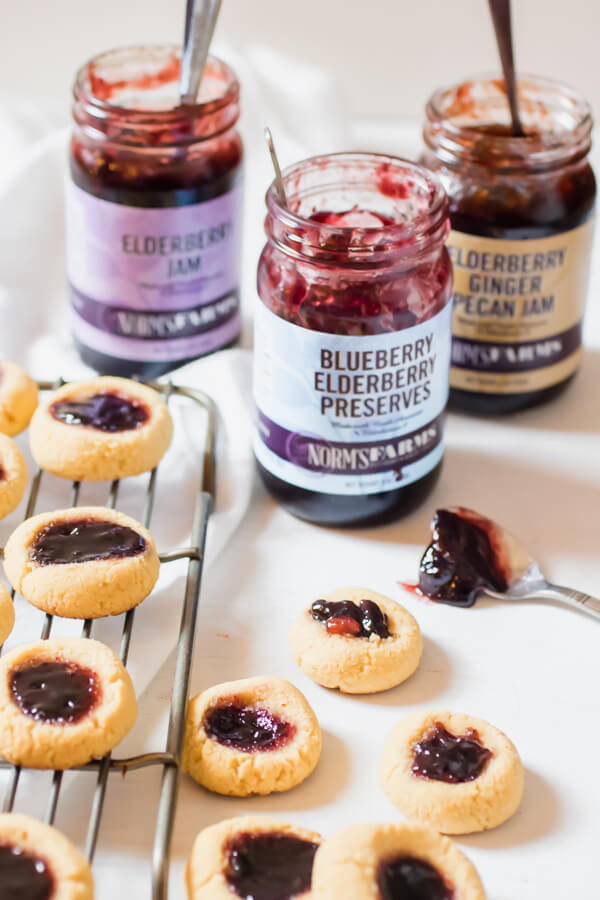 Perfectly moist and delicious gluten-free, grain-free thumbprint cookies with immune supportive elderberry Jam.