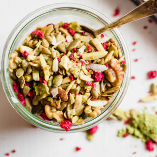 A super simple grain-free granola recipe with matcha green tea powder, coconut, and dried raspberries. Low carbohydrate, paleo friendly, vegan, and addictively good! 
