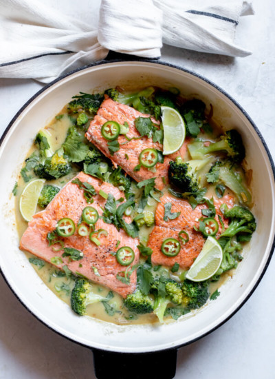 Green curry salmon in one pan on white background