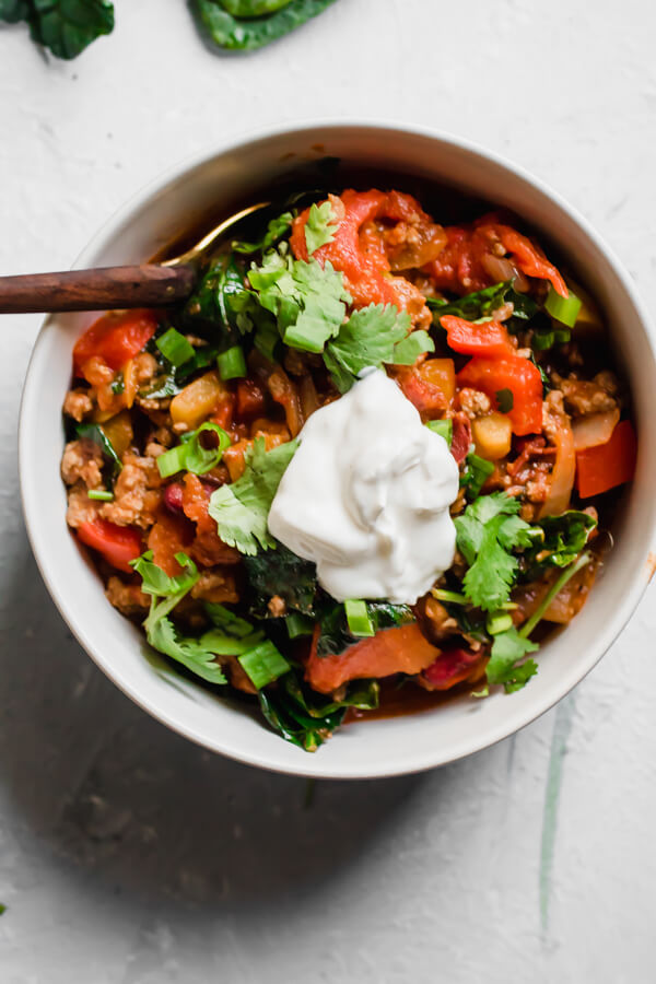 30 minute quick and healthy kale and grass-fed beef chili, loaded with good for you veggies and the perfect amount of spices. Perfect for a healthy quick weeknight meal or a long lazy Sunday afternoon. Chili, but healthier. 