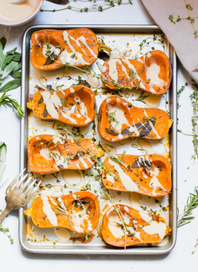 Mouthwatering herb roasted honeynut squash with a miso tahini sauce. Perfect for a quick weeknight meal, or a festive holiday side dish. Gluten-free, vegan, paleo.