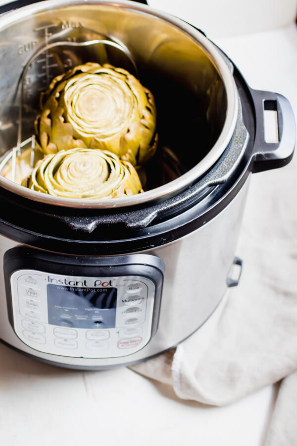 Simply steamed artichokes made quick and easy in the Instant Pot. Yielding perfectly tender results. Ideal as a healthy appetizer, side dish or snack, paired with a healthy and delicious parmesan basil dip!