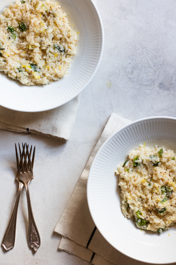 2 white bowls of Instant Pot Risotto with Wild Ramps and Parmesan