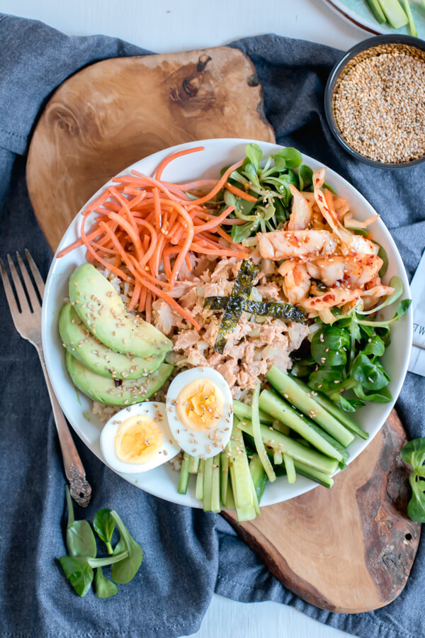 Super simple, healthy and delicious Korean Tuna Power Bowls. Brown rice, a rainbow of veggies, and Korean tuna salad, drizzled with a yummy sesame dressing. The perfect healthy lunch ready in 5 minutes!