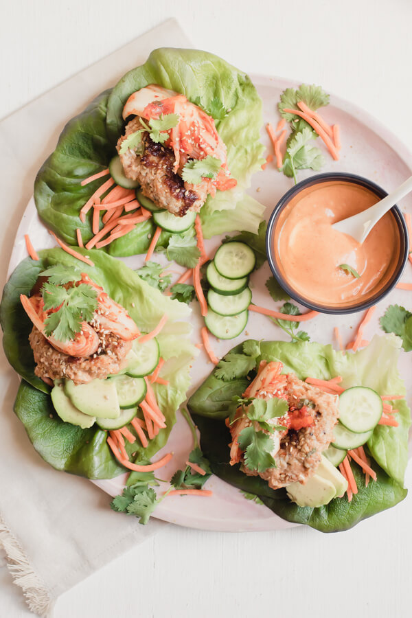 Seriously the most flavorful moist turkey burger you have ever had! Piled high in crisp lettuce leaves with carrots, kimchi, avocado, and a special Korean inspired sauce. Perfect for a crowd!