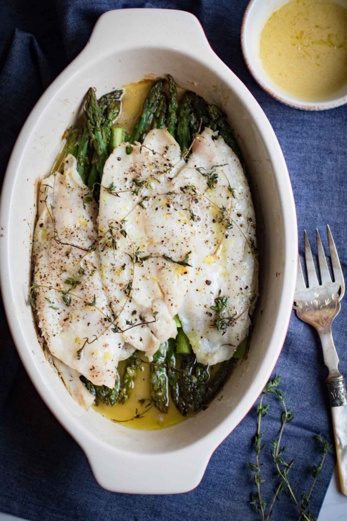 Lemon Thyme Roasted Sole and Asparagus with a creamy dijon lemon sauce. A delicious easy to prepare roasted fish dish that is gluten free, paleo friendly, and whole 30 compliant. Spring is here, and you should celebrate with this perfectly seasonal roasted sole. |abraskitchen.com