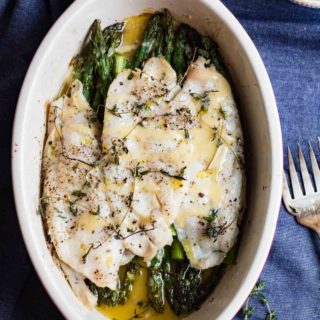 Lemon Thyme Roasted Sole and Asparagus with a creamy dijon lemon sauce. A delicious easy to prepare roasted fish dish that is gluten free, paleo friendly, and whole 30 compliant. Spring is here, and you should celebrate with this perfectly seasonal roasted sole. |abraskitchen.com