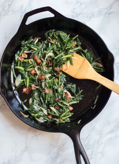 Crisp salty bacon, sweet onions, and earthy maple syrup combine with nutritious dandelion greens in this healthy and easy side dish. Paleo, Whole 30, Gluten-Free, Liver-Support. YUM YUM! |abraskitchen.com