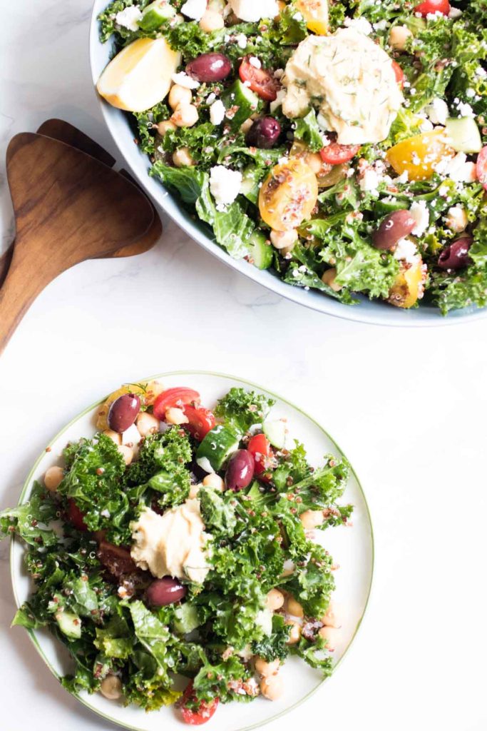 Greek kale and quinoa salad meal prep bowls are addictively delicious.