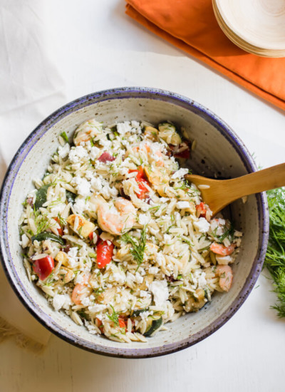 Loaded with fresh roasted vegetables, shrimp, dill, and feta cheese this Mediterranean inspired lemony orzo salad is a quick and easy summer side dish and is fantastic served warm or cold. 