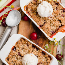 Easy 7-ingredient paleo cherry rhubarb crumble. Served in individual portion, for a quick and delicious summer dessert for 2. Oat-free, refined sugar-free, gluten-free, and vegan optional. 