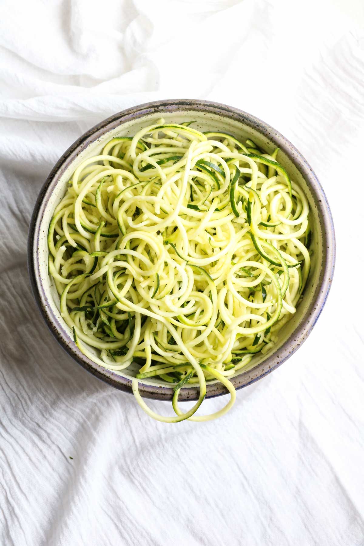 These crazy addictive peanut noodles are so delicious you won't believe they are good for you! Zucchini noodles (zoodles) are the star! Gluten free, vegan, vegetarian. Get full recipe on www.abraskitchen.com