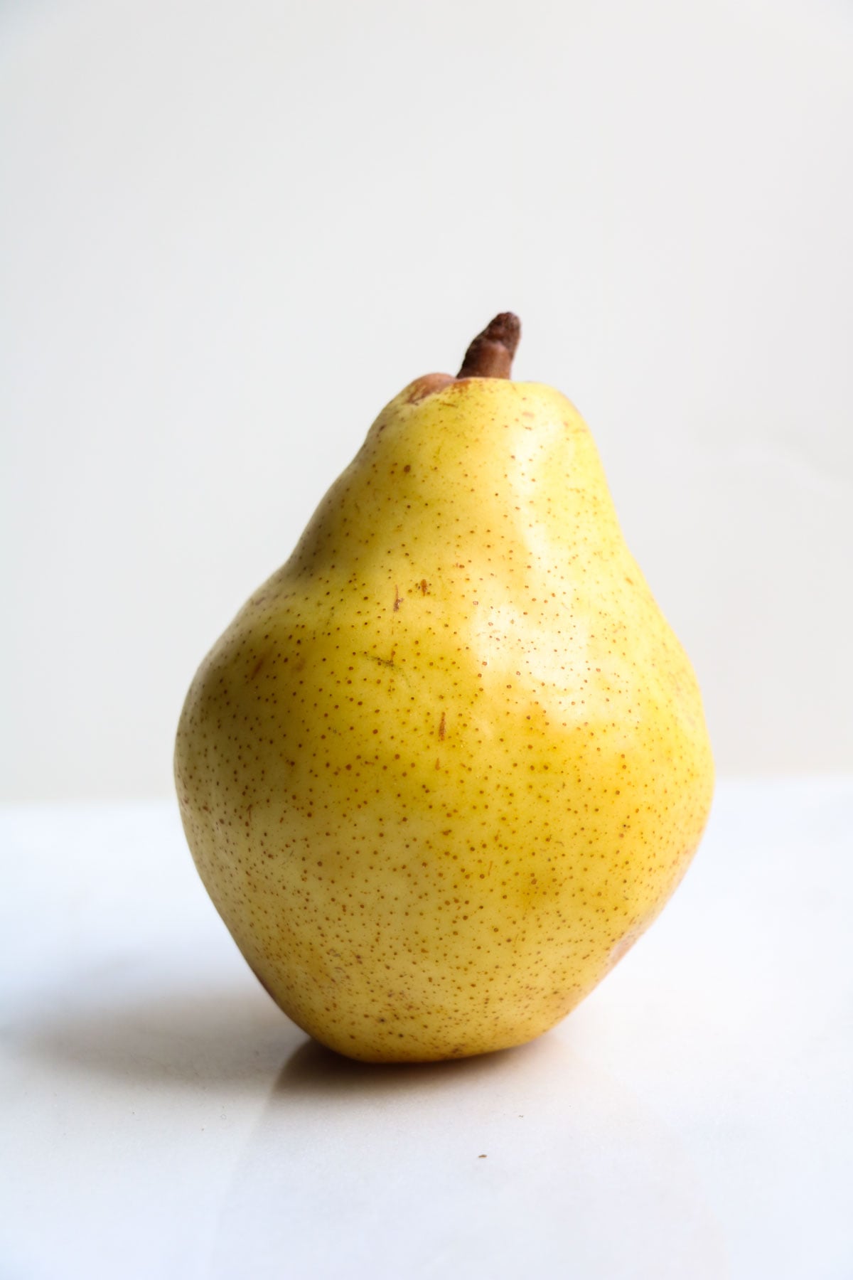 a pear in front of a white background