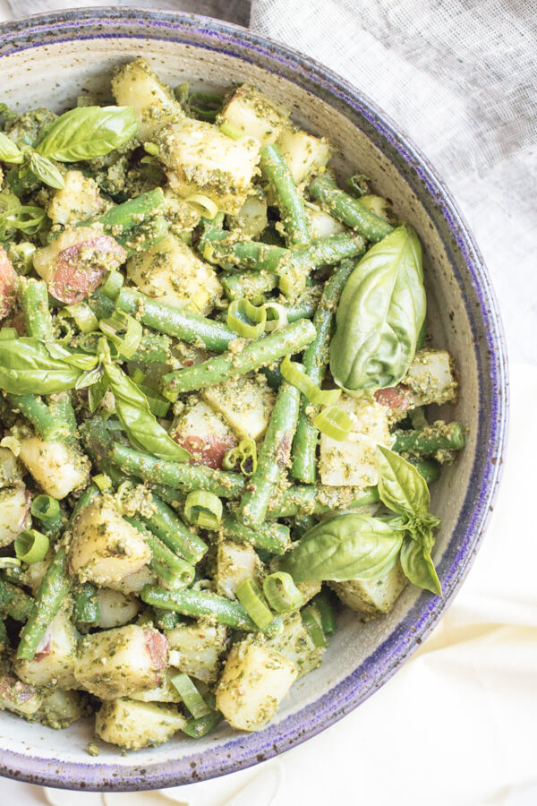 A bright and healthy side dish bursting with summer flavor. Almond pesto potato salad with green beans is easy to make and loaded with good for you ingredients, the perfect alternative to a mayonnaise-based potato salad. 