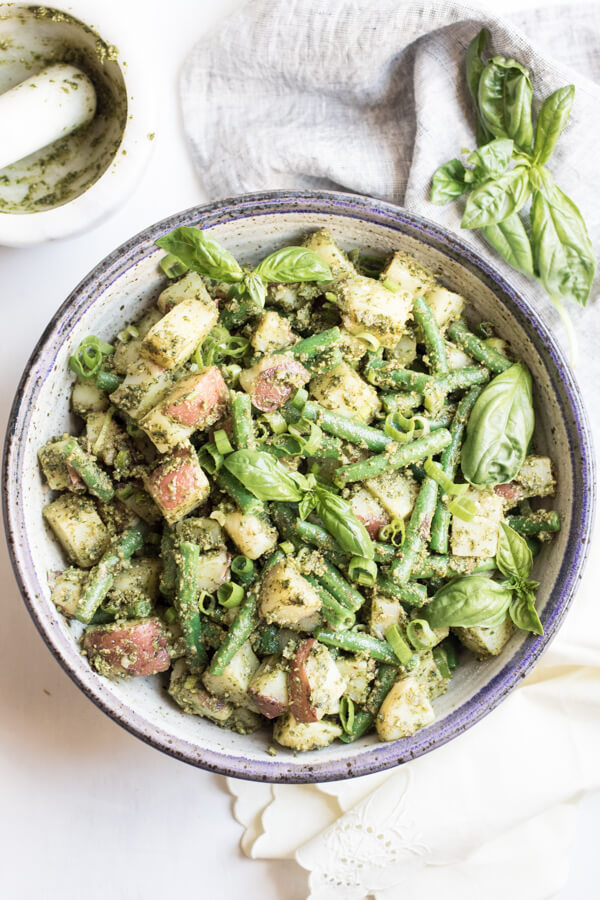 A bright and healthy side dish bursting with summer flavor. Almond pesto potato salad with green beans is easy to make and loaded with good for you ingredients, the perfect alternative to a mayonnaise-based potato salad. 