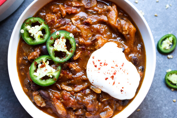 This pumpkin turkey chili recipe is sweet and spicy, the perfect combination of pumpkin, ground turkey, warming spices, and lots of black beans. Yum!