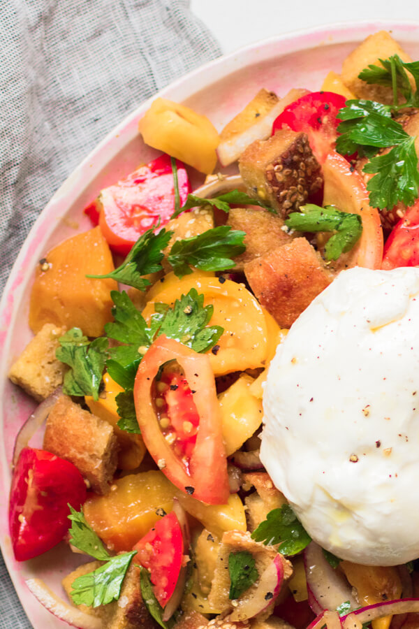 Roasted Beet Panzanella Salad - toasted bread with roasted beets, fresh tomato, parsley, and creamy burrata cheese all tossed together with a bright and tangy balsamic vinaigrette. An easy to prepare nourishing and insanely delicious salad.