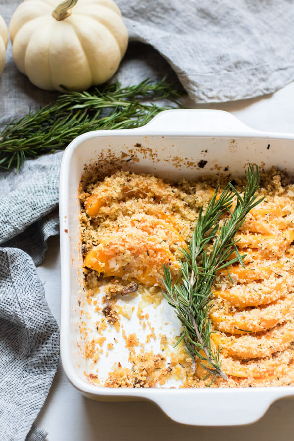 Roasted butternut squash coated with a shallot garlic butter and then topped with crunchy parmesan rosemary breadcrumbs.  Thanksgiving side dish. Gluten Free (with GF breadcrumbs), Yummy! |abraskitchen.com #sidedish #Thanksgiving
