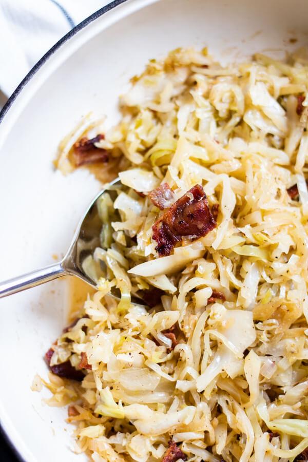 Easy Sauteed Cabbage, Sauerkraut, and Bacon, close up shot on a large spoon