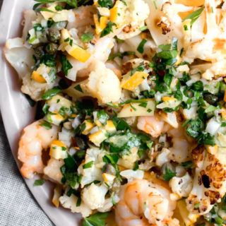 Perfectly roasted shrimp and cauliflower tossed with a bright and tangy Meyer lemon salsa. Dinner is done in 13 minutes! Paleo, gluten-free, quick, healthy, and easy.