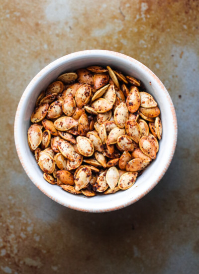 Perfectly roasted seeds from acorn, butternut, spaghetti, or delicata squash. Salty, crunchy, spicy and addictively delicious. Also full of nutrients and minerals! |abraskitchen.com #roastedseeds #pumpkinseeds