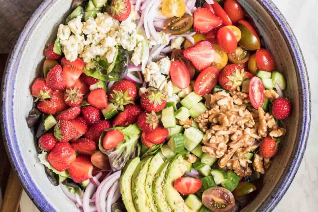Sweet strawberries, creamy avocado, and addictive blue cheese come together to create the worlds most perfect summer salad.