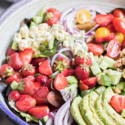 Sweet strawberries, creamy avocado, and addictive blue cheese come together to create the worlds most perfect summer salad.