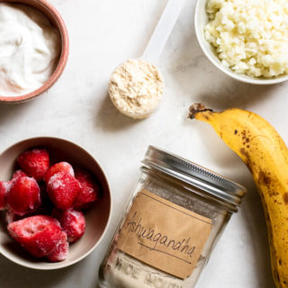 Ingredients for Strawberry Banana Adaptogen Smoothie on a white background