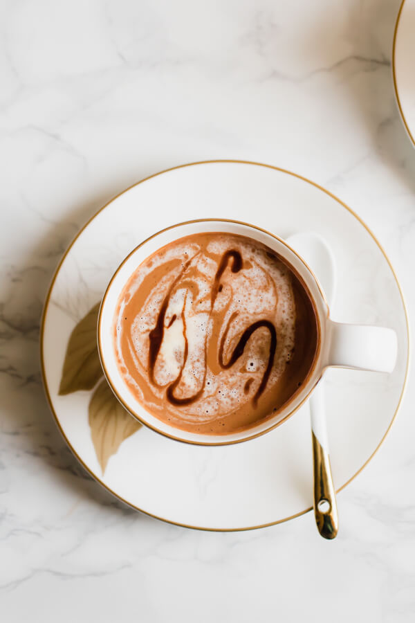 A rich and creamy vegan hot chocolate recipe touched with a pinch of fragrant cardamom and nutty tahini. Hot chocolate that is loaded with good for you ingredients and easily prepared in 5 minutes!