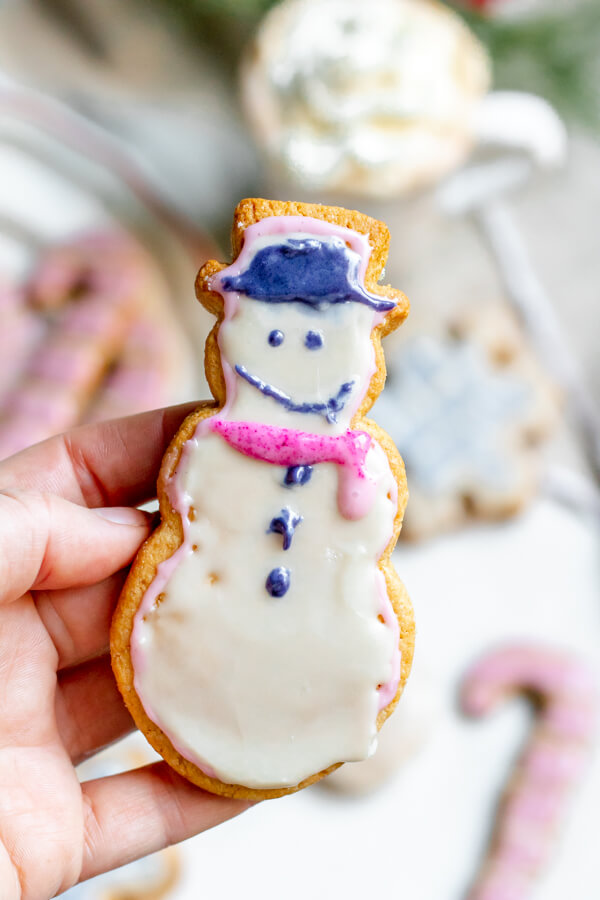 almond flour sugar cookie in the shape of a snowman