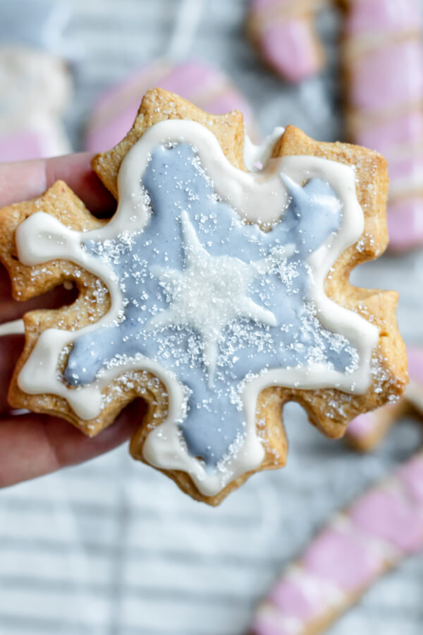 close up of almond flour sugar cookie in the shape of a snowflake