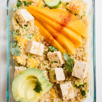 Sweet and spicy, tangy and luscious. This healthy vegan meal prep bowl is everything! Sweet mango with tangy lime and spicy chili powder, crunchy cucumbers, creamy avocado, tangy protein-rich tofu, and hearty quinoa. I'm happy to have this lunch on repeat all week long.