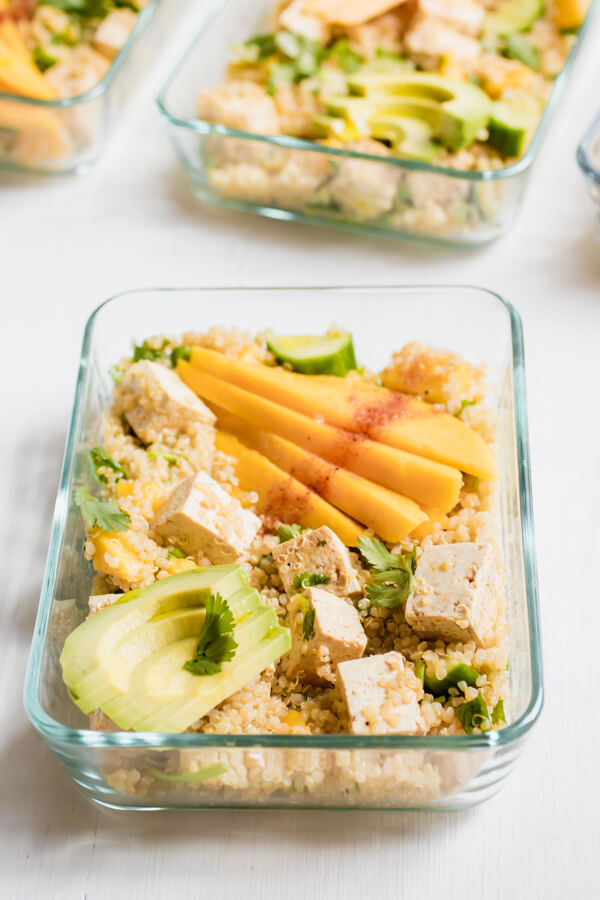 Sweet and spicy, tangy and luscious. This healthy vegan meal prep bowl is everything! Sweet mango with tangy lime and spicy chili powder, crunchy cucumbers, creamy avocado, tangy protein-rich tofu, and hearty quinoa. I'm happy to have this lunch on repeat all week long.