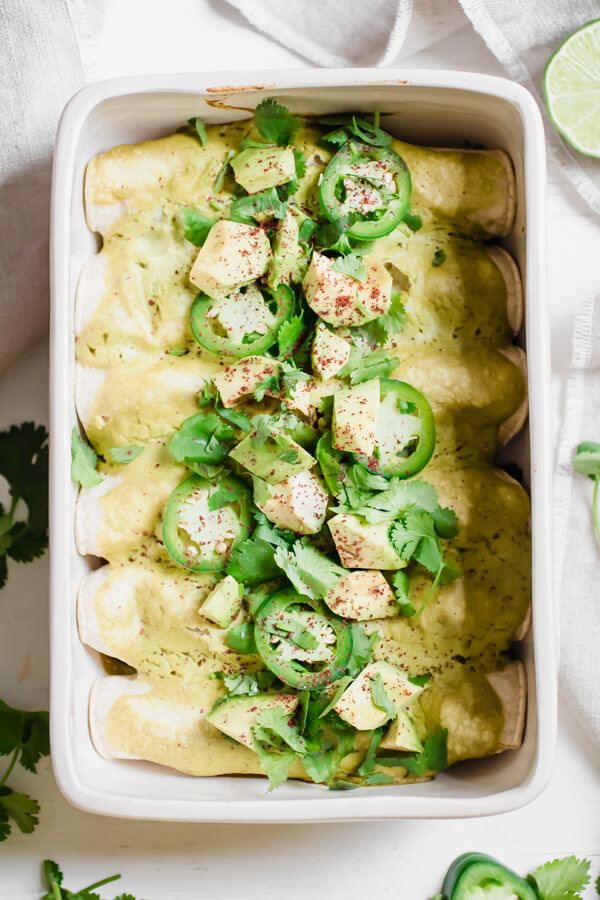 Easy Vegan Brussels Sprout and Mushroom Enchiladas with a creamy green enchilada sauce. A healthy homemade meal bursting with flavor your whole family will love! 