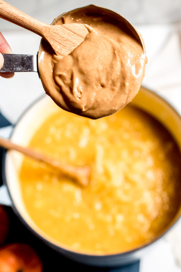 Vegan Peanut Butter Pumpkin Soup served in a pumpkin. 5 Simple Ingredients!